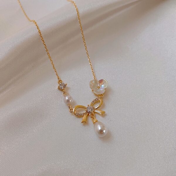 Pearl White Flower Butterfly Knot Necklace Design